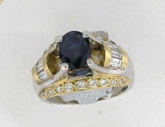 14k Two Tone Oval Shape Blue Sapphire Center Stone with Round Cut Diamonds and Diamond Baugettes Ring 2.39 Ctw 